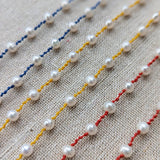 Collier perles 4 nœuds