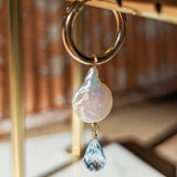 Mono spring pearl and topaz loop